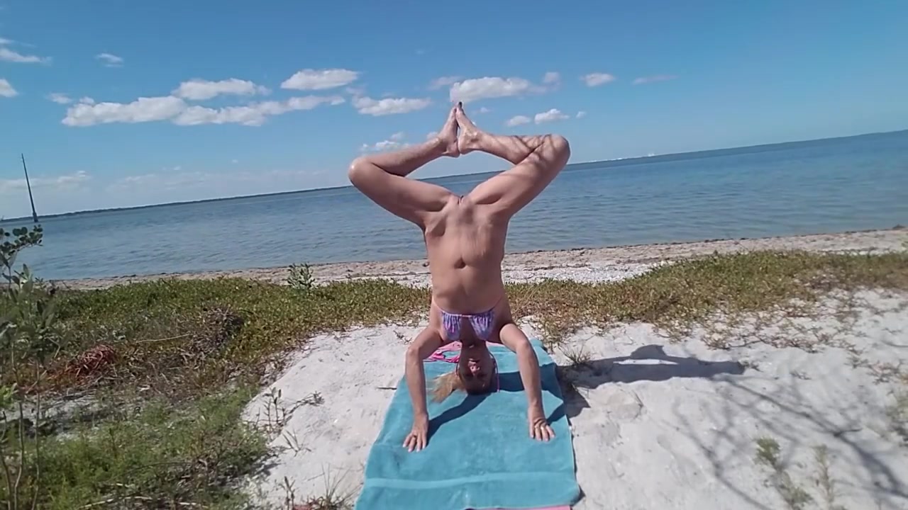Webcam nude yoga at a public beach photo