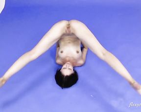 Flexible nude girl does yoga porn exercises in the studio
